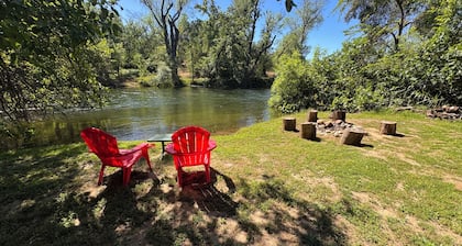 Rustic cozy cabin on rivers edge