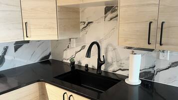 Fridge, microwave, stovetop, coffee/tea maker