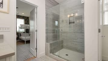 Shower, hair dryer, towels, shampoo
