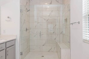 Shower, hair dryer, towels, shampoo