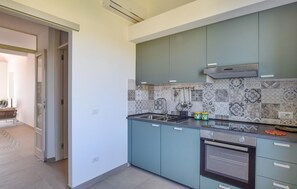 Fridge, stovetop, coffee/tea maker