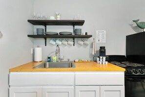 Fridge, cookware/dishes/utensils, dining tables