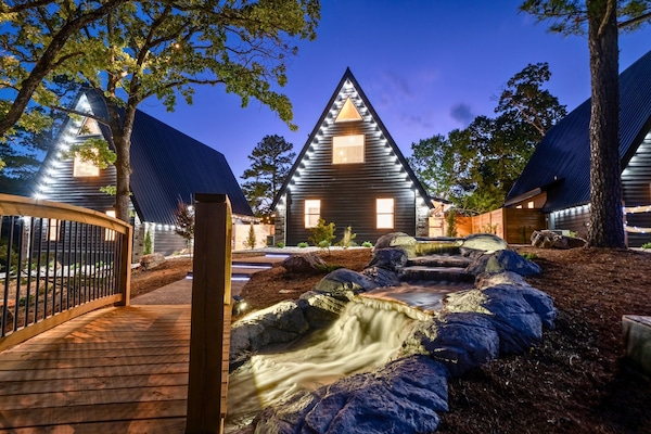 Walk this charming boardwalk to reach your very own A-frame—part modern retreat, part storybook escape.
