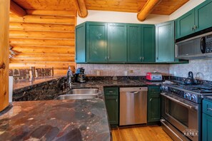 Enjoy cooking in this kitchen with an oven, microwave, and dishwasher.