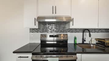 Family Apartment, 2 Bedrooms, Patio, Mountain View | Private kitchen | Coffee/tea maker, dining tables