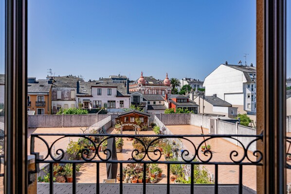 A residential area with a mix of modern and traditional architecture, including a prominent building with domes.