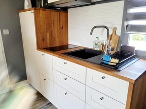 Fridge, microwave, stovetop, coffee/tea maker