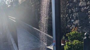 A stone wall with a water feature. - Imperio vert adventure with a view (Tabua)