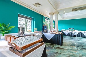 A banquet hall with tables set for a formal event, a coffee station, and a view of the outdoors. - Winchester Wessex Hotel by Sunday Twin Room (Winchester)