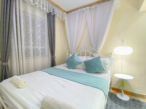 Deluxe Room | Desk, laptop workspace, blackout drapes, soundproofing - Beautiful Spaces (Kampala)