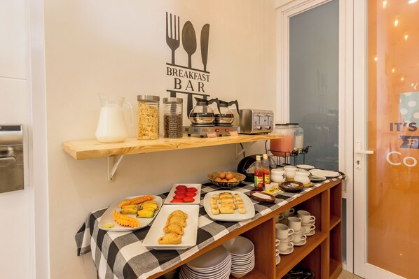 A breakfast bar with various food items and breakfast beverages. - Omah Manis Taman Siswa (Yogyakarta)
