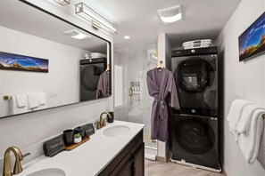 Shower, hair dryer, towels, shampoo
