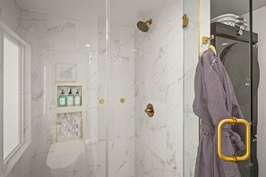 Shower, hair dryer, towels, shampoo