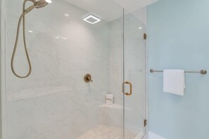 Shower, hair dryer, towels, shampoo