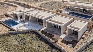 A modern villa with multiple rooms, a swimming pool, and a landscaped garden. - Villa Quintessa (Povljana)