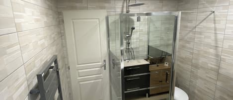 Shower, hair dryer, towels, toilet paper