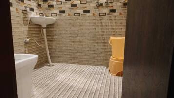 Standard Double Room, City View | Bathroom | Shower, free toiletries, slippers, towels