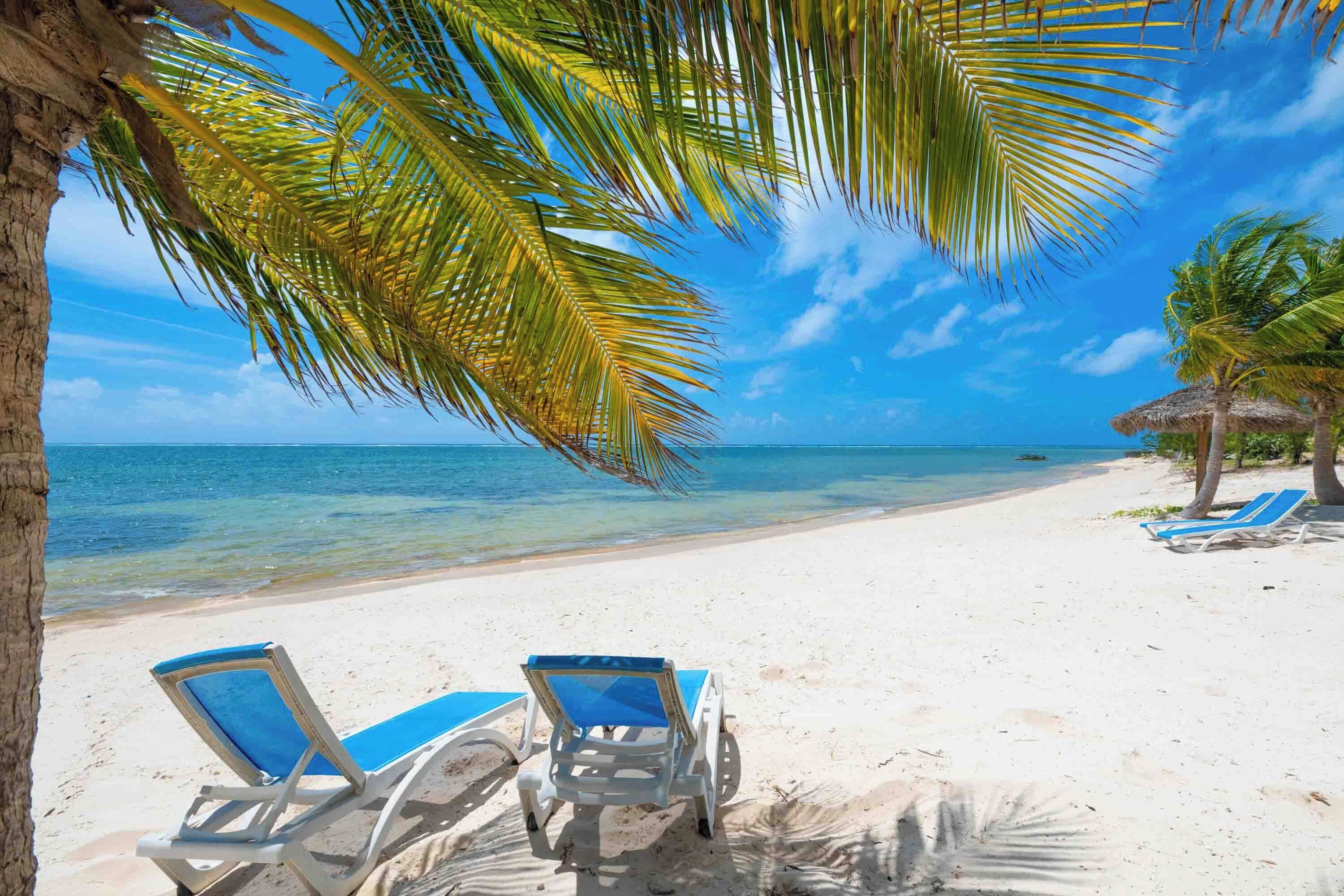 On the beach, sun-loungers, beach towels