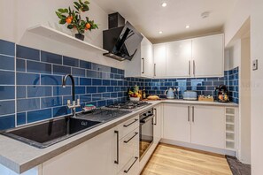 Fridge, oven, coffee/tea maker, toaster