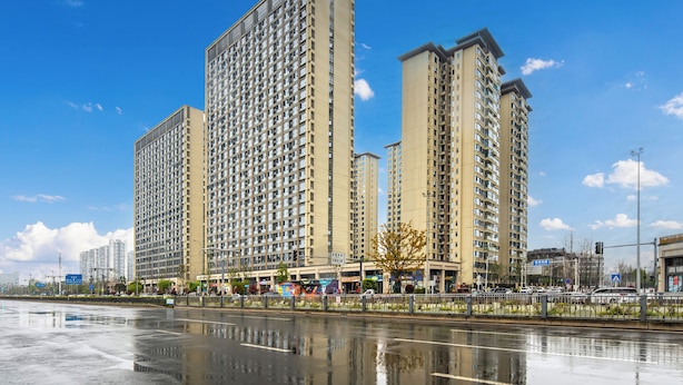 A high-rise residential building with multiple floors, large windows, and a flat roof. - Serveyou Apartment (Chengdu)
