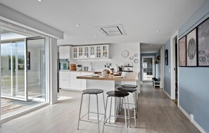 Fridge, stovetop, dishwasher, coffee/tea maker