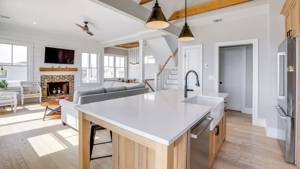 A spacious kitchen with a large island, wooden beams, and modern appliances. - Steps From Sand & Fun: Beach Haven Retreat w/ Pool (Beach Haven)