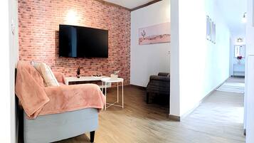 Apartment, 2 Schlafzimmer, Terrasse, Gartenblick | Wohnzimmer