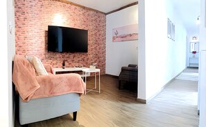 Apartment, 2 Schlafzimmer, Terrasse, Gartenblick | Wohnzimmer