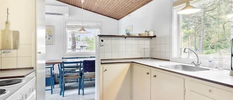 Fridge, stovetop, coffee/tea maker, dining tables