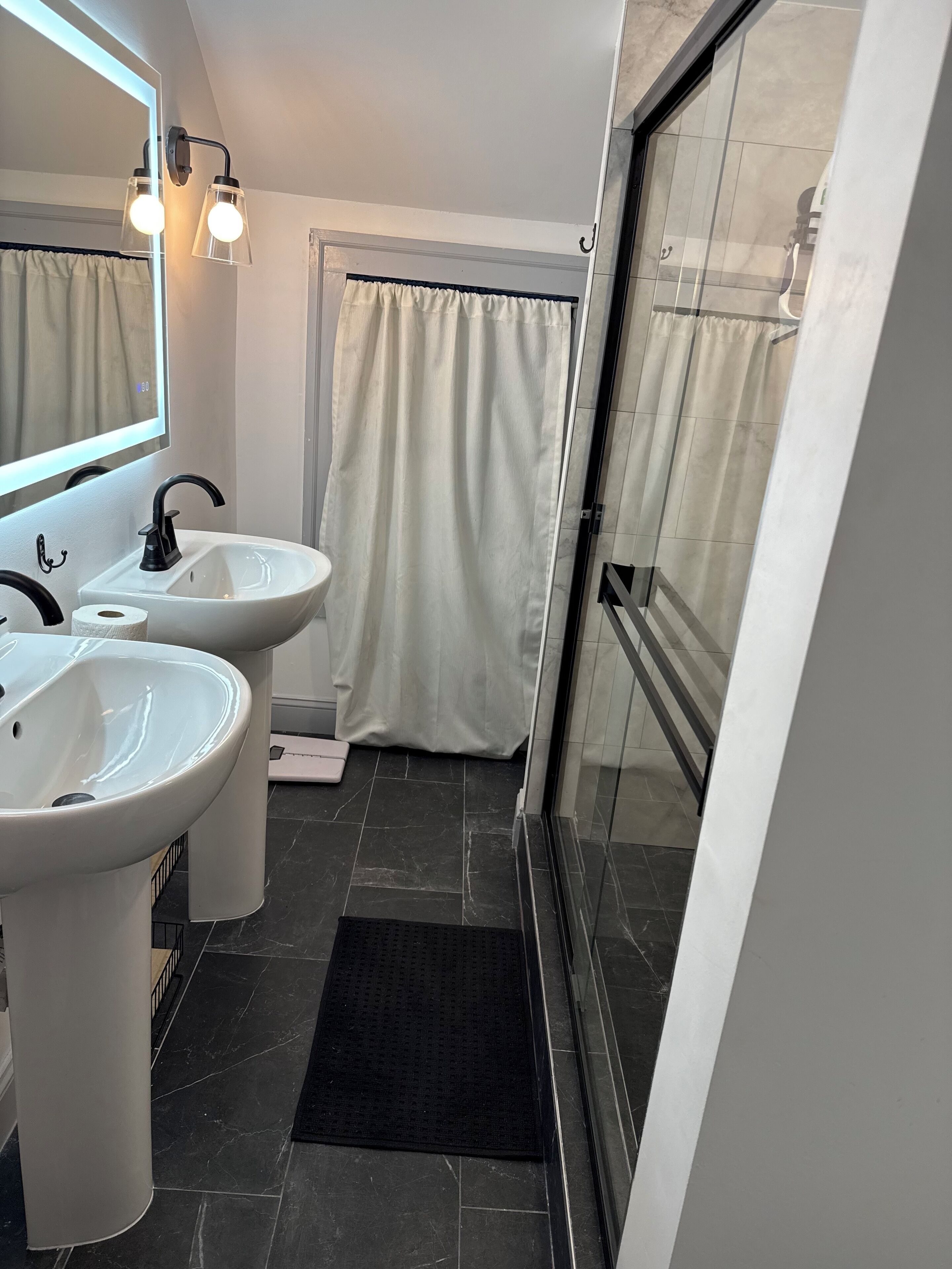 Shower, hair dryer, towels, toilet paper