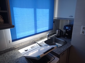 Fridge, microwave, coffee/tea maker, toaster