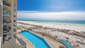 A hotel with a pool, beach view, and multiple balconies. - Phoenix X506  Feel the Sea Breeze (Orange Beach)