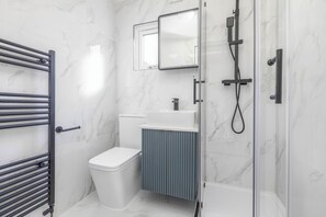 Shower, hair dryer, towels, soap