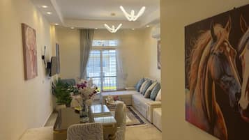 Luxury Apartment, City View | Living area | Netflix, streaming services
