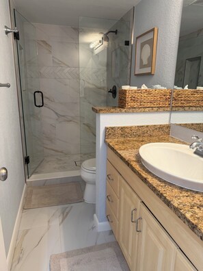 Shower, hair dryer, towels, soap
