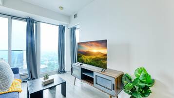 Honeymoon Apartment | Living area | 60-inch TV with cable channels
