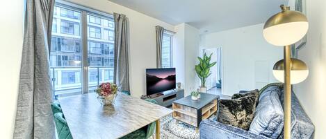 Superior Apartment | Living area | 60-inch TV with cable channels