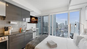 Superior appartement | Woonruimte | Een 60-inch televisie met kabelzenders