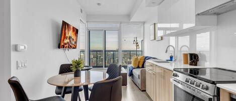 Honeymoon Apartment | Living area | 60-inch TV with cable channels