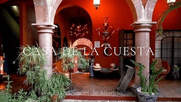 A traditional Spanish courtyard with stone columns, potted plants, and a rustic interior. - Casa de la Cuesta Bed and Breakfast (San Miguel de Allende)