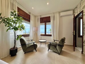 Deluxe Villa, 5 Bedrooms, Patio, Garden View | Living area | 70-inch Smart TV with cable channels