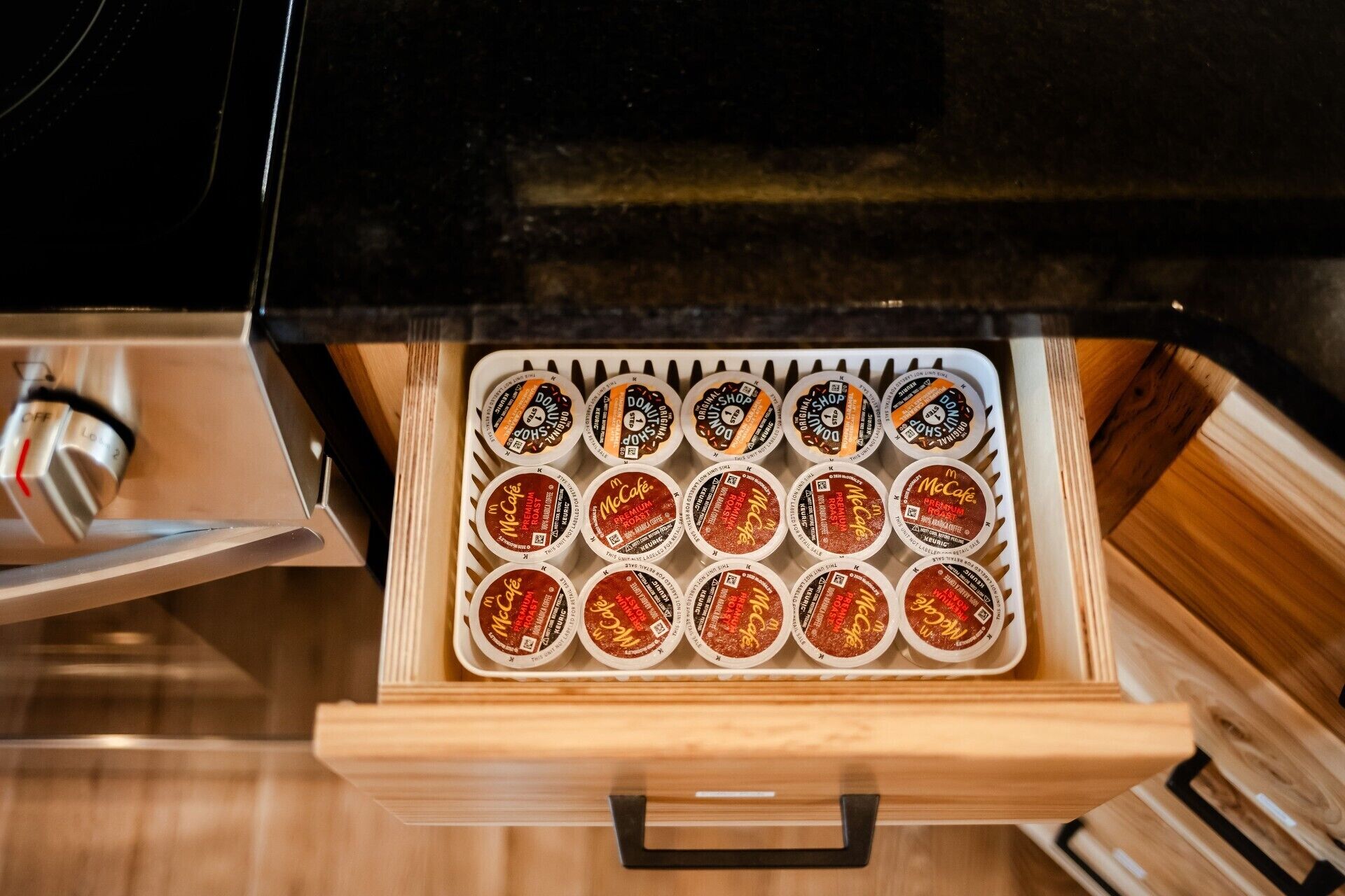 A drawer containing McCafe Premium Roast coffee pods.