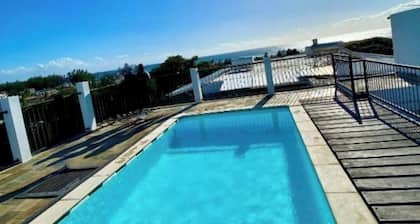 Cozy 2-bedroom apartment with rooftop pool