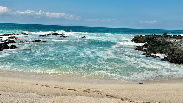 A beach with rocky shoreline and clear blue water. - Charming 2-bedroom apartment  in COL Majahua, Troncones, Mexico GRO. (COL Majahua)