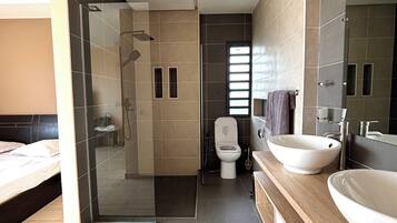 Shower, towels, soap, toilet paper