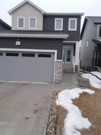 Exterior. Furnished basement with seperate entrance ,living room,washroom and kitchenette
