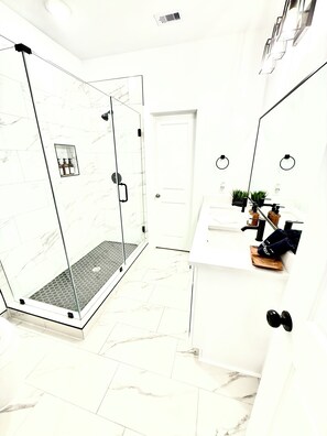 Shower, hair dryer, towels, soap