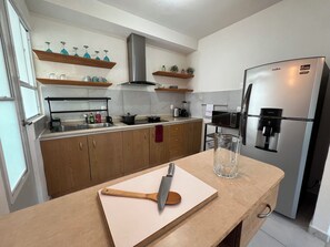 Fridge, microwave, stovetop, coffee/tea maker