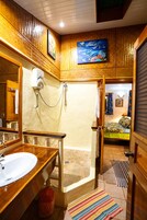 Family Room, Balcony | Bathroom | Shower, towels, toilet paper