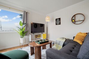 Family Apartment, 2 Bedrooms, Kitchen, Mountain View | Living area | 55-inch LED TV with digital channels